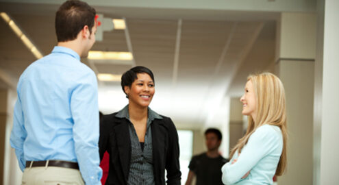 Group of people talking at work