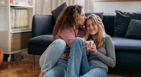 Mother and daughter embrace after a heartfelt discussion